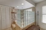 Master en-suite shower and jetted tub with glass block privacy